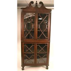 A CHIPPENDALE STYLE CARVED MAHOGANY CORNER CABINET
