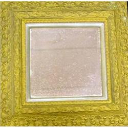 A GILTWOOD SHELL- CARVED HANGING WALL MIRROR