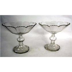 A PAIR OF COLORLESS GLASS FOOTED COMPOTES
