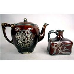 A BROWN GLAZED STERLING SILVER OVERLAY TEAPOT