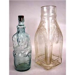 A COLORLESS GLASS FIGURAL POLAND WATER BOTTLE