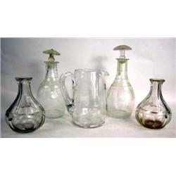 A GROUP OF ASSORTED COLORLESS GLASS DECANTERS AND PITCHER
