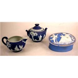 A BLUE WEDGWOOD CREAMER AND SUGAR BOWL