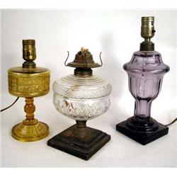 A GROUP OF THREE ASSORTED FLUID LAMPS