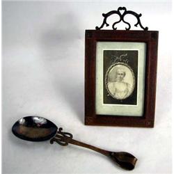 AN ARTS AND CRAFTS PICTURE FRAME AND SPOON