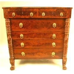 A LATE FEDERAL CARVED AND FIGURED MAHOGANY CHEST OF DRAWERS