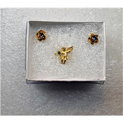 19)  GOLD TONE WITH BLUE CRYSTAL