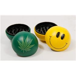 LOT OF TWO GRINDERS (HAPPY FACE, PLANT LEAF)