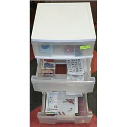 WHITE 4 DRAWER PLASTIC STORAGE UNIT FULL OF
