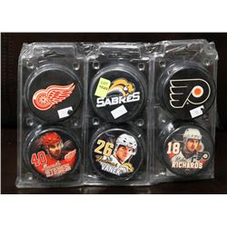LOT OF 6 COLLECTIBLE PUCKS