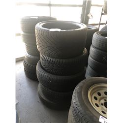 STACK OF ASSORTED TIRES