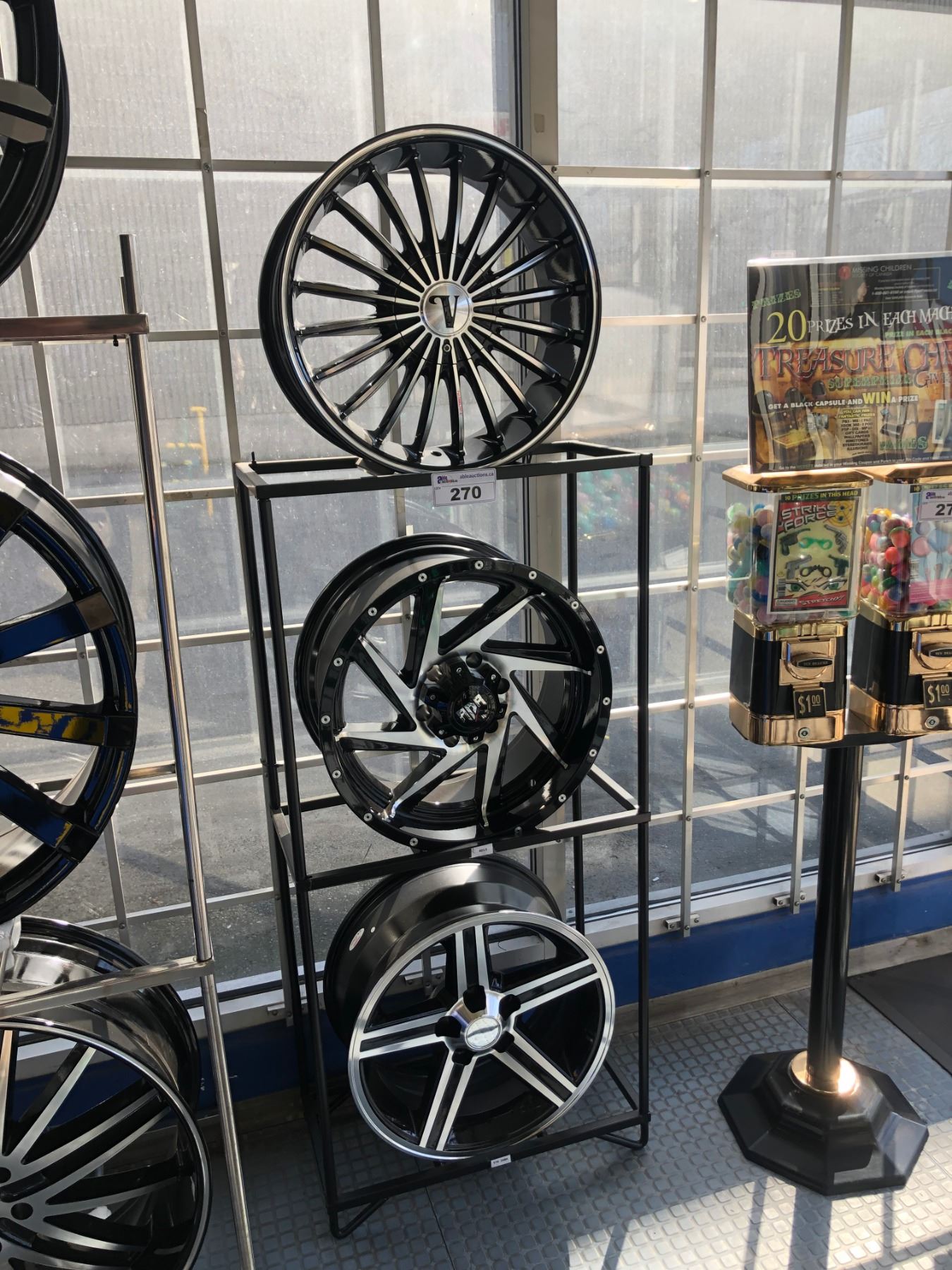 3 ASSORTED NEW ALLOYS RIMS ON DISPLAY STAND