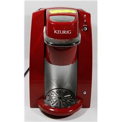 RED KEURIG COFFEE MACHINE.
