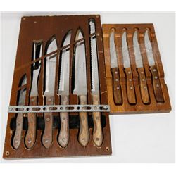 TWO SETS OF VINTAGE KNIVES IN DISPLAY CASES.