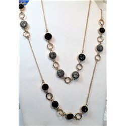 21)  DOUBLE STRAND GOLD TONE & BLACK &