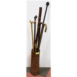 LOT OF 6 ASSORTED CANES IN CARVED WOOD HOLDER