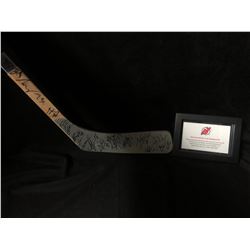 NEW JERSEY DEVILS TEAM SIGNED HOCKEY STICK ( CSI HOLOGRAM)