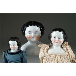 THREE CHINA HEAD DOLLS
