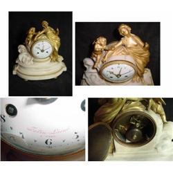 FRENCH ALABASTER MANTEL SILK THREAD; TIME AND STRIKE AND CALENDAR; CHERUB AND FEMALE STATUS; SOMETHI