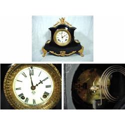ANSONIA CAST IRON MANTEL TIME AND STRIKE PORCELAIN DIAL WITH FRENCH SASH; ORMOLU HAS BEEN REPAINTED;