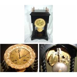 UNMARKED FRENCH EMPIRE BLACK WITH FOUR TWISTED ROPES; BRASS BEZEL WITH BRASS RAYED DIAL; 4 PINEAPPLE