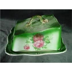 PORCELAIN CHEESE KEEPER HAND PAINTED IN A PINK ROSE MOTIF ON GREEN, TWO PIECES. 4.5"X7"X8".