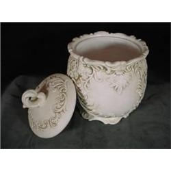 INARCO NUMBER 299 COOKIE JAR IN A CREAMY BONE PORCELAIN WITH EMBOSSED SWIRLS. 7"X5"