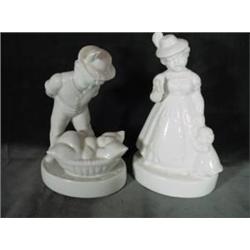 PAIR OF PORCELAIN FIGURINES, A BOY AND A GIRL IN A BONE COLORED PORCELAIN.  MARKED ON BOTTOM. 6"X3.5