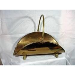 BRASS LOG HOLDER WITH HANDLE AND CLAW FEET. 9"X23