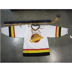 SIGNED CANUCKS YOUTH JERSEY AND WALL SHELF