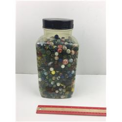 LARGE PLASTIC JAR OF ‘VINTAGE’ MARBLES