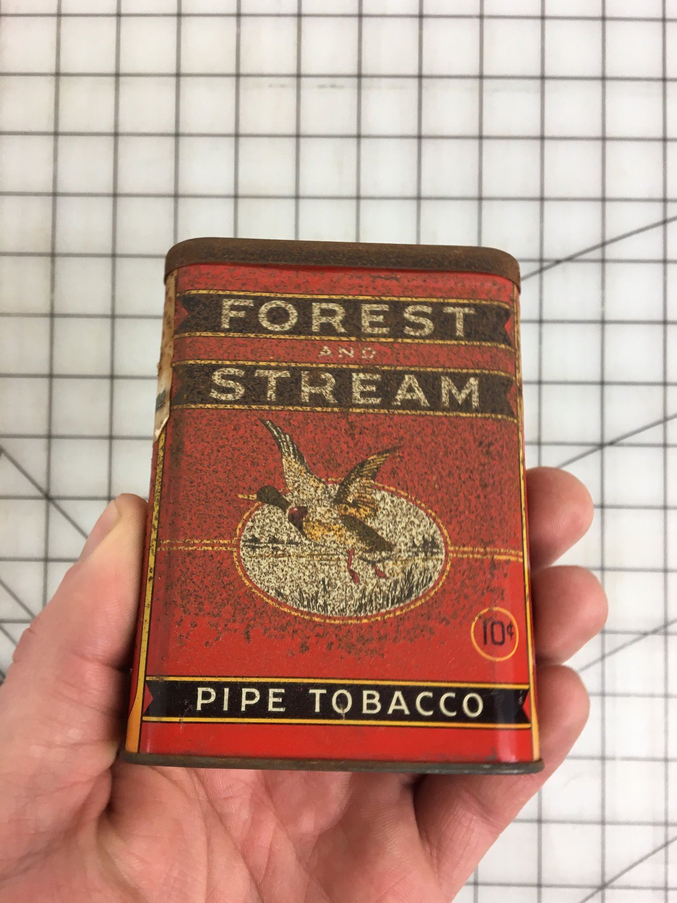 FOREST AND STREAM’ PIPE TOBACCO POCKET TIN Schmalz Auctions