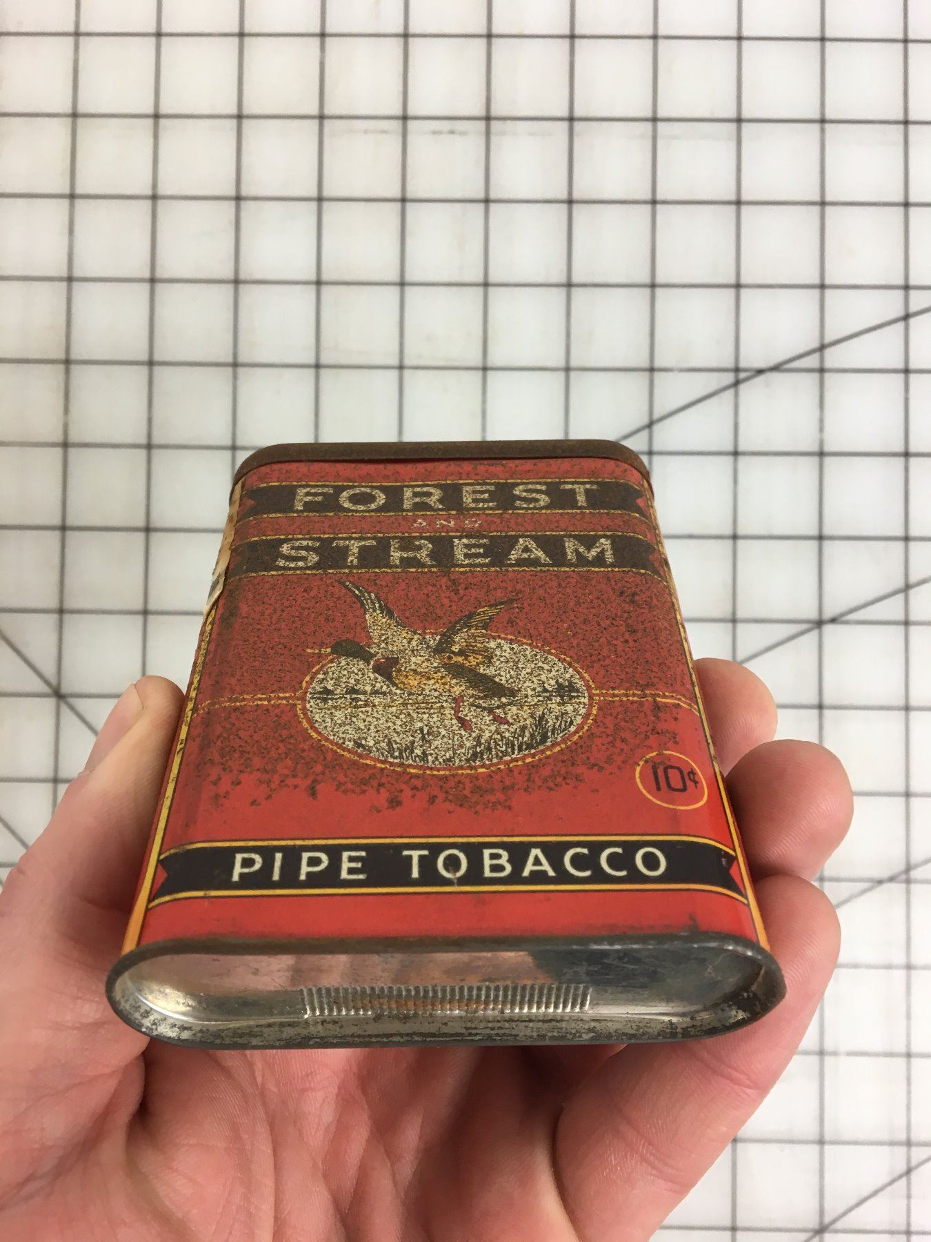 FOREST AND STREAM’ PIPE TOBACCO POCKET TIN Schmalz Auctions