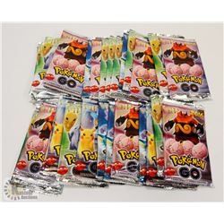 LOT OF 29 PACKS OF POKÉMON GO TRADING CARDS.