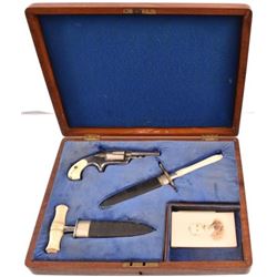 Cased Ivory Pistol and Daggers Set