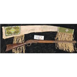 Winchester 1873 38.40 octagon barrel rifle with great beaded scabbard