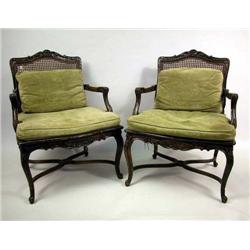 A PAIR OF REGENCY STYLE CARVED AND CANED FAUTEUIL