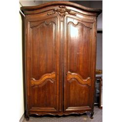 A LOUIS XV CARVED OAK ARMOIRE