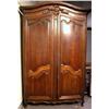 Image 1 : A LOUIS XV CARVED OAK ARMOIRE