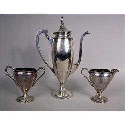 A THREE-PIECE STERLING SILVER FOOTED COFFEE SERVI