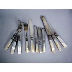 A PARTIAL SET OF MOTHER-OF-PEARL HANDLED FLATWARE