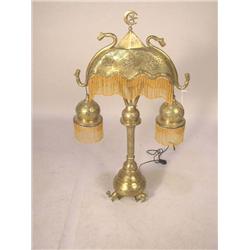 A MOORISH STYLE PIERCED BRASS TABLE LAMP