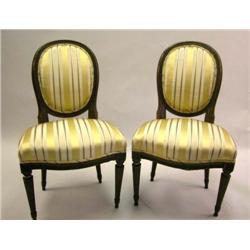 A PAIR OF LOUIS XVI CARVED WALNUT CHAISES