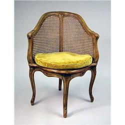 A LOUIS XV STYLE CARVED AND CANED DESK CHAIR