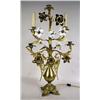 Image 1 : A PATINATED METAL FIVE-LIGHT CANDELABRA
