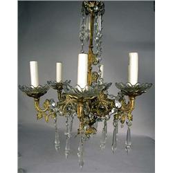 A SIX-LIGHT PATINATED METAL HANGING CHANDELIER