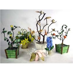 A GROUP OF DECORATIVE POTTED FLOWERS AND BIRDS
