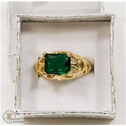 EMERALD GREEN STONE RING SET IN 10KT.