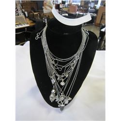 LOT OF CHAIN NECKLACES ON STAND
