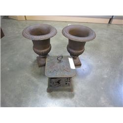 2 CAST IRON PLANTERS AND CAST IRON CANDLE HOLDER